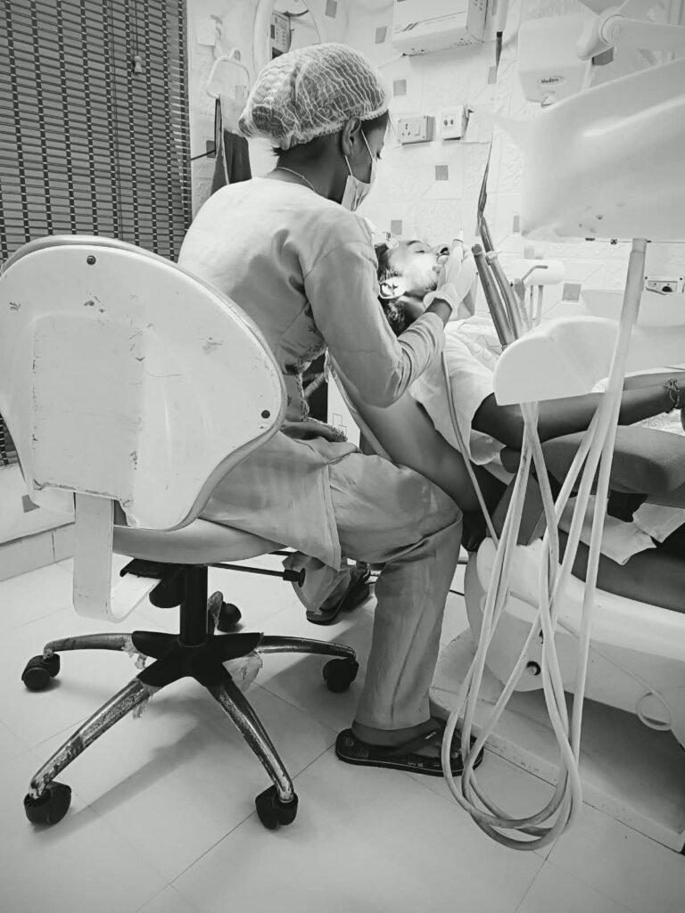 The dentist carefully examines and works on the patient's teeth